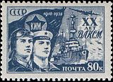 20-лет ВЛКСМ (1938): военный летчик и Краснофлотец в бескозырке с надписью «Марат» (корабль на втором плане — крейсер типа «Светлана»)