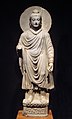 Будда в греко-буддийском стиле I—II вв. Гандхара (современный Пакистан). (Стоящий Будда в Национальном музее Токио)