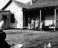 The family of Johnnie David Hutchins stands in front of the Hutchins cottage in Lissie after he was posthumously awarded the Medal of Honor (April 1944).
