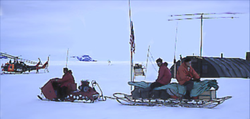 Sleds pulled by snowmobiles or dogs provided transportation between camps around 1960