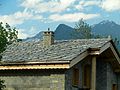 Image 20Alpine chalet being built in Haute-Maurienne (Savoy), the use of thick pieces of orthogneiss (4–7 cm) is by the strict architectural regulations in the region bordering the national parks of Vanoise-Grand Paradis. (from Alps)