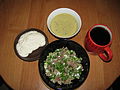 Classic okroshka with beef. Nearby are plates of smetana, a special dressing (made from pounding yolks, خردل (چاشنی), ترب کوهی، green onion, and salt), and a cup of کواس