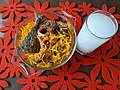 Abacha with fried fish and a glass of palm wine