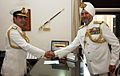 Admiral RK Dhowan being congratulated by SPS Cheema after taking over as new Chief of Naval Staff