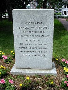 A picture of a monument for Samuel Whittemore with the inscription "Near this spot, Samuel Whittemore, then 80 years old, killed three British soldiers, April 19, 1775. He was shot, bayoneted, beaten and left for dead, but recovered and lived to be 96 years of age."