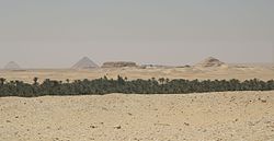 Landscape around Kafr Ammar, with the Bent and Red pyramids of Sneferu, Mastabat al-Fir'aun, and Pyramid of Pepi II visible in the background