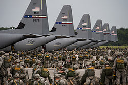 Soldiers from the US Army's 82nd Airborne Division prepare for a mass parachute jump from US Air Force C-130J Hercules aircraft during a Joint Operation Access exercise at Pope Field in 2013.