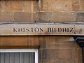 Uppercase eng with the reversed-N-form on the Kingston Buildings in Bath, UK.