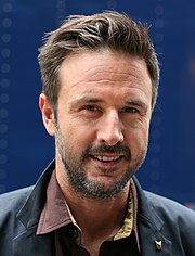 A smiling headshot of David Arquette