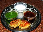 Aloo tikki, served with chutneys