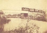 Old photograph of the railway bridge across the river near Boliqueime