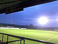 View from the seated stand with the floodlights on.