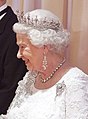 Elizabeth II wearing Greville Chandelier Earrings, 2010