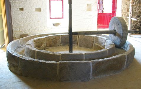 "Apple lathe" driven by a horse. Ring-shaped trough serving as a lying millstone. The Elms, Jersey