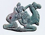 Nomadic figure, typically with a long nose, on a Bactrian camel. Southern Ningxia, 4th century BC.[107][105]