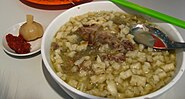 Paomo is a specialty of Shaanxi cuisine and is a typical food eaten in the city of Xi'an. It is a hot stew of chopped-up steamed leavened bread cooked in lamb broth and served with lamb meat. Beef is also sometimes used.