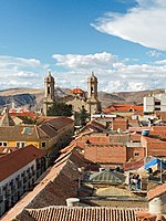 Look at the city from above, with the prominent church towers