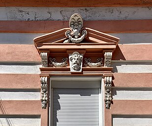 Beaux Arts acroterion above a window of Strada Grigore Cobălcescu no. 14, Bucharest, unknown architect or sculptor, c.1900