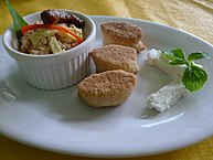 Traditional full Filipino breakfast with kesong puti, pandesal, sinangag (garlic rice), and a longganisa sausage