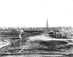 Fish drying on racks in Anvik in 1901