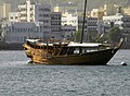 Muscat Harbor – A traditional Omani Dhow lays anchored in the Muscat Harbor (World's largest natural harbor)