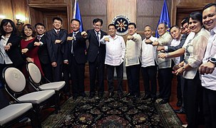 Duterte pose with Chinese government officials on January 9, 2017.
