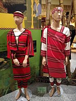 Female and male mannequins dressed in striped red clothes.