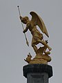 Gilt statue of St Michael atop the church