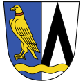 Gemeinde Feldkirchen-Westerham Gespalten von Blau und Silber; vorne ein goldener Falke mit rotem Halsband, hinten ein schwarzer Sparren; unten ein gesenkter, durchgehender goldener Wellenbalken.