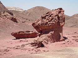 Structures created by wind erosion, which has differentially removed rock according to hardness and the height of wind-blown sand; Timna, Negev, Israel.