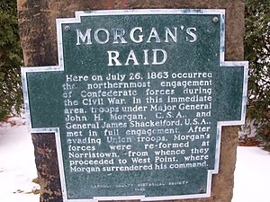 aluminum plaque bolted to sandstone. Plaque is shape of outline of Carroll County, Ohio, with raised letters that read: "MORGAN'S RAID Here on July 26, 1863 occurred the northernmost engagement of Confederate forces during the Civil War. In this immediate area, troops under Major General John H. Morgan, C.S.A., and General James Shackleford, U.S.A., met in full engagement. After evading Union troops, Morgan's forces were re-formed at Norristown, from whence they proceeded to West Point, where Morgan surrendered his command. CARROLL COUNTY HISTORICAL SOCIETY 1969"