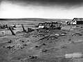 Image 13 Dust Bowl Photo credit: Sloan, USDA Buried machinery in a barn lot, Dallas, South Dakota, United States, due to Dust Bowl conditions, May 1936. Dust storms from 1930–1939 caused major ecological and agricultural damage to American and Canadian prairie lands. This ecological disaster was a result of drought conditions coupled with decades of extensive farming using techniques that promoted erosion. More featured pictures