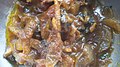 A Bengali dish of stir-fried freshwater snails with onion and garlic paste and other spices, from Kolkata, West Bengal, India