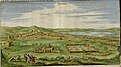 Two men and a lion in the foreground of a landscape showing a green valley across which can be seen a densely-built city -->