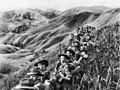 Image 25Australian soldiers resting in the Finisterre Ranges of New Guinea while en route to the front line (from New Guinea)