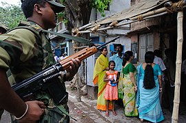 A Border Security Force soldier carrying an L1A1 rifle in West Bengal during elections, 2009