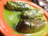 Stuffed grape leaves with yoghurt mint sauce