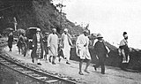 Chittaranjan Das with cane in hand, and Mahatma Gandhi on the Hill Cart Road near Kakjhora, Darjeeling in 1925