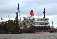The Queen Elizabeth slowly slides into the dock