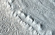 Enlargement of area in rectangle of the previous image. On Earth the ridge would be called the terminal moraine of an alpine glacier. Picture taken with HiRISE under the HiWish program. Image from Ismenius Lacus quadrangle.