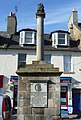 The cross at Musselburgh, East Lothian, topped by the burgh arms