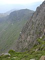 Typical steep grassy and loose section of cliff