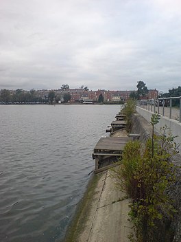 A lake with houses on one side