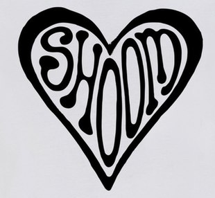 Shoom's logo which comprises the name of the club written in a font influenced by 1960's Psychedelic art, around which is a border in the shape of a love-heart. This is a black-and-white version, but it came in other colour combinations