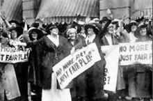 Marie Dressler and Ethel Barrymore holding signs that say "No More Pay, Just Fair Play" with other strikers