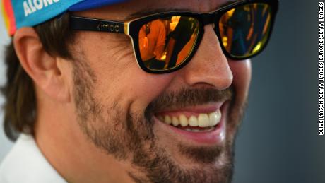 ABU DHABI, UNITED ARAB EMIRATES - NOVEMBER 22:  Fernando Alonso of Spain and McLaren F1 talks to the media in the Paddock during previews ahead of the Abu Dhabi Formula One Grand Prix at Yas Marina Circuit on November 22, 2018 in Abu Dhabi, United Arab Emirates.  (Photo by Clive Mason/Getty Images)