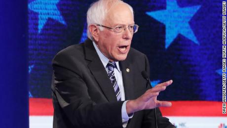 MIAMI, FLORIDA - JUNE 27: Democratic presidential candidate former Vice President Joe Biden looks on as Sen. Bernie Sanders (I-VT) speaks during the second night of the first Democratic presidential debate on June 27, 2019 in Miami, Florida.  A field of 20 Democratic presidential candidates was split into two groups of 10 for the first debate of the 2020 election, taking place over two nights at Knight Concert Hall of the Adrienne Arsht Center for the Performing Arts of Miami-Dade County, hosted by NBC News, MSNBC, and Telemundo. (Photo by Drew Angerer/Getty Images)