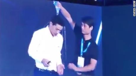 Robin Li, the co-founder and CEO of Chinese search engine Baidu, was delivering a speech on self-driving and connected cars when a young man came on stage and tipped a bottle of water over Li&#39;s head.