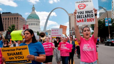 Abortion-rights supporters march Thursday, May 30, 2019, in St. Louis. A St. Louis judge heard an hour of arguments Thursday on Planned Parenthood&#39;s request for a temporary restraining order that would prohibit the state from allowing the license for Missouri&#39;s only abortion clinic to lapse at midnight Friday. (AP Photo/Jeff Roberson)