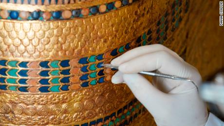 Rami Magdy works on the restoration of a chariot from Tutankhamun&#39;s tomb at the Wood Laboratory in the Grand Egyptian Museum&#39;s conservation center. The first phase of the GEM will open the end of this year and will feature a special display of thousands of treasures from Tutankhamun&#39;s tomb, many never  before on dislplay.